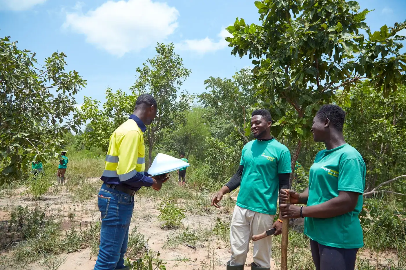 An EcoPlanet supervisor with field staff in the Ashanti Region, Ghana